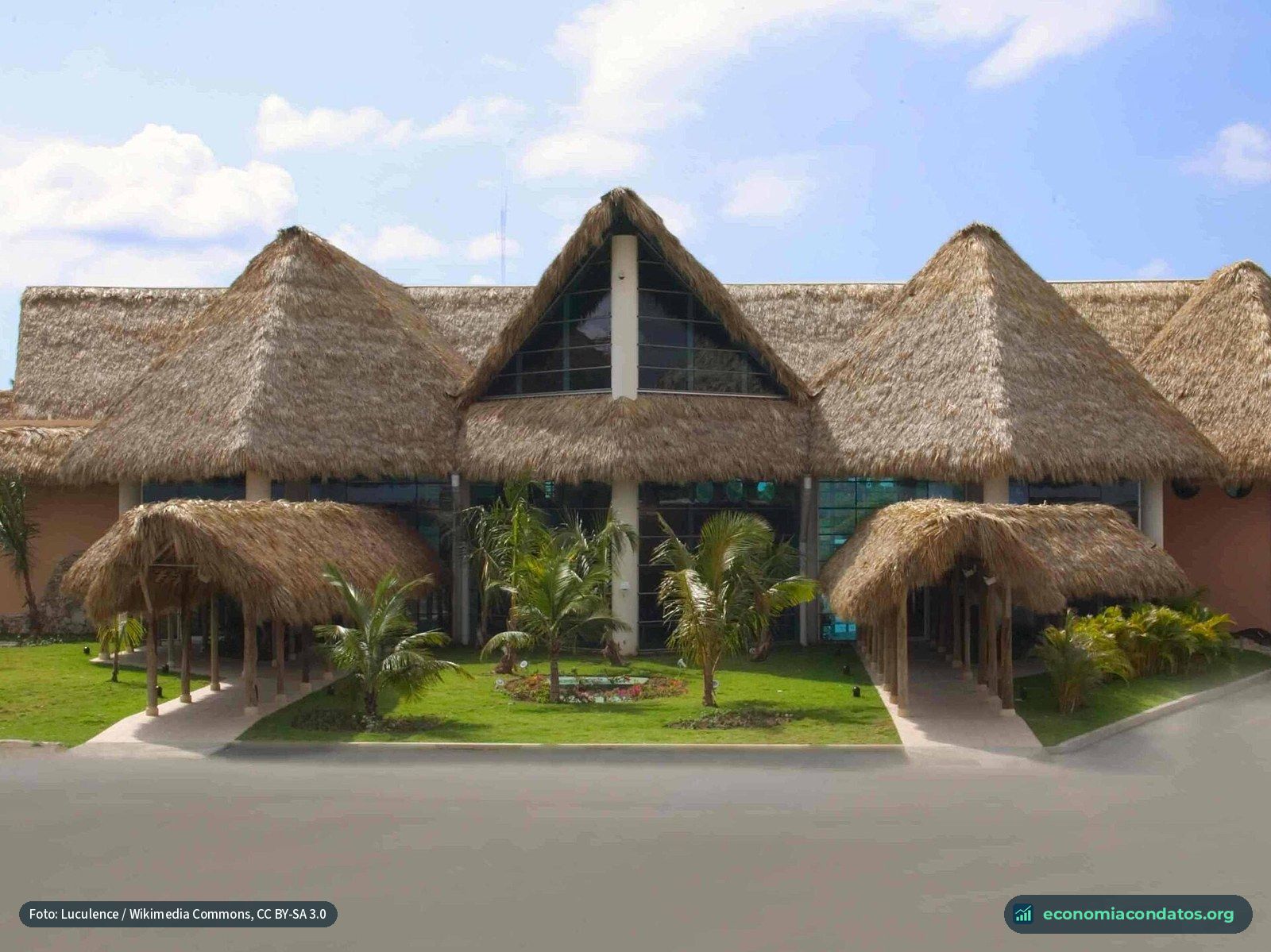 Punta Cana International Airport terminal, with palm-thatched roofs